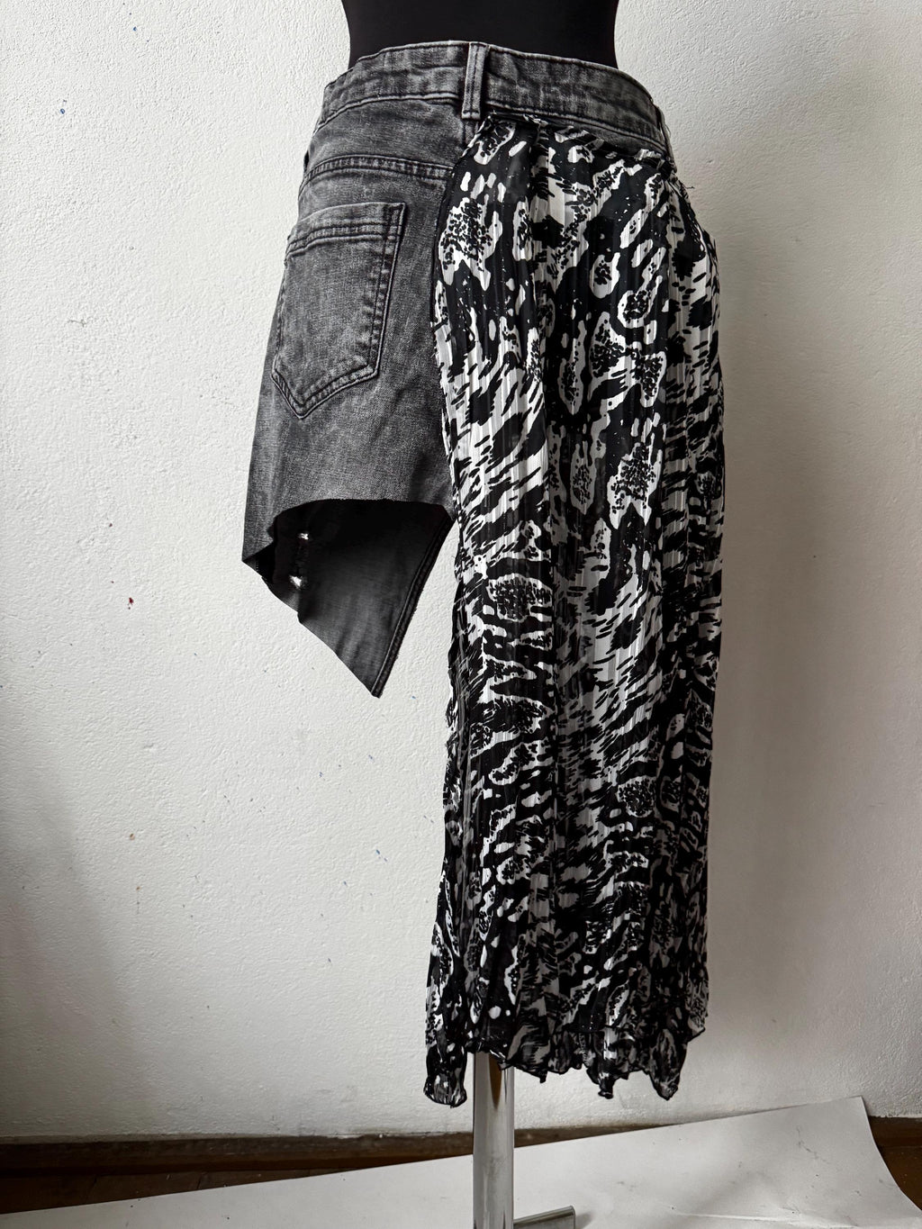 Skirt over jeans, recycled materials, contemporary design