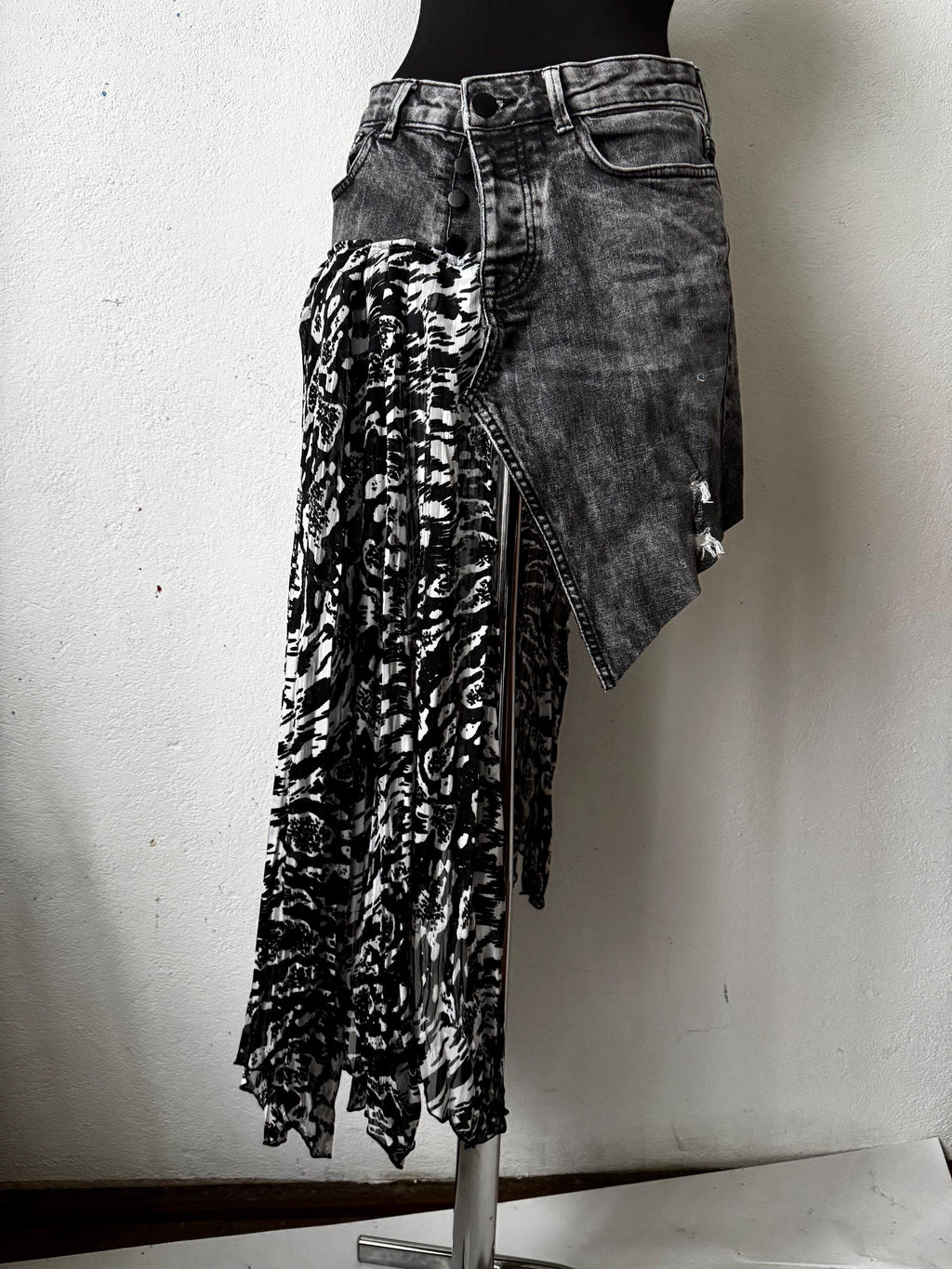 Skirt over jeans, recycled materials, contemporary design