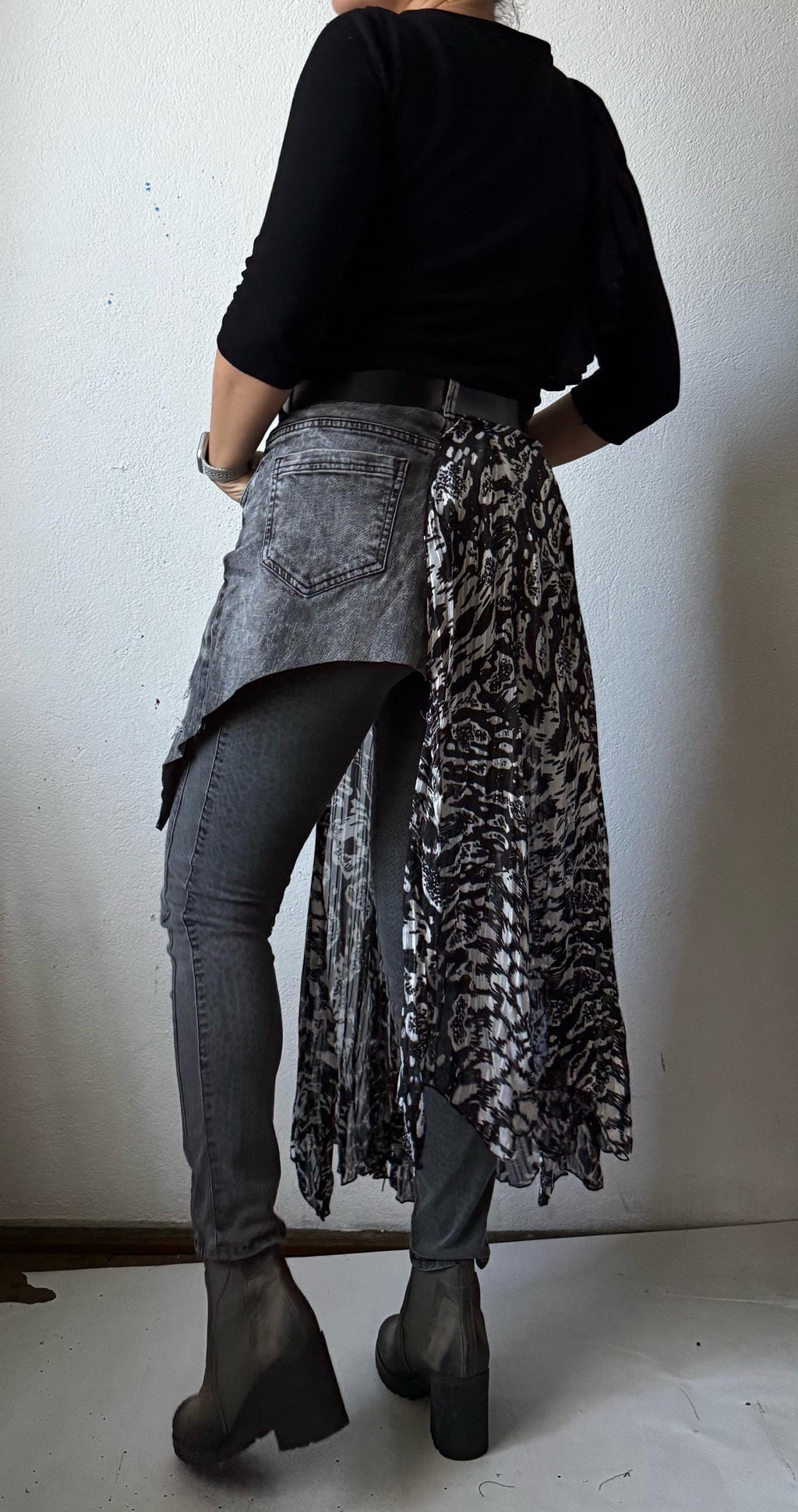 Skirt over jeans, recycled materials, contemporary design